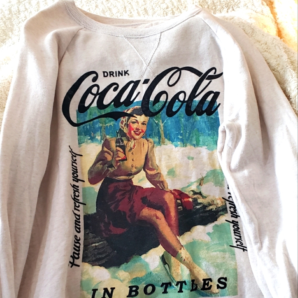 vintage coca cola style luck brand sweat shirt.  cream colored in new condition